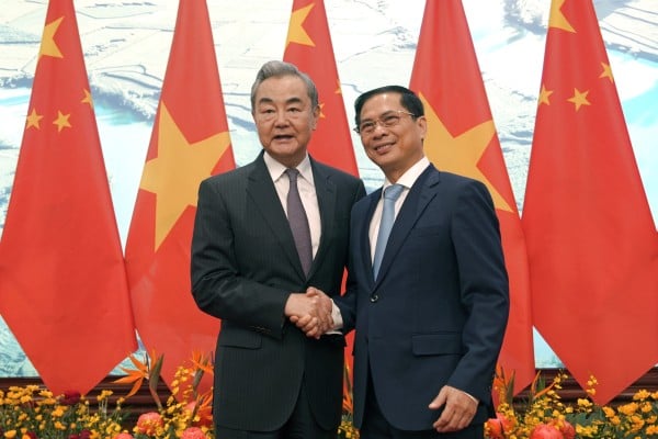 Chinese Foreign Minister Wang Yi with Vietnamese counterpart Bui Thanh Son, in Hanoi on March 17. They co-chaired a meeting on bilateral cooperation. Photo: Xinhua Chinese Foreign Minister Wang Yi with Vietnamese counterpart Bui Thanh Son, in Hanoi on March 17. They co-chaired a meeting on bilateral cooperation. Photo: Xinhua
