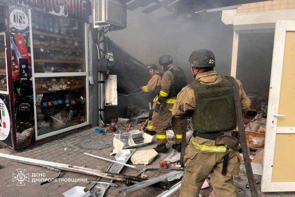 Firefighters work at a market hit by a Russian drone strike in Nikopol, Ukraine, on Saturday. Photo: Handout via Reuters Firefighters work at a market hit by a Russian drone strike in Nikopol, Ukraine, on Saturday. Photo: Handout via Reuters