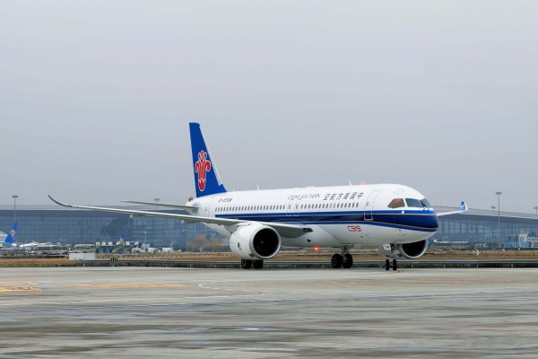 A domestically-produced C919 lands at Guangzhou Baiyun International Airport. Photo: Handout