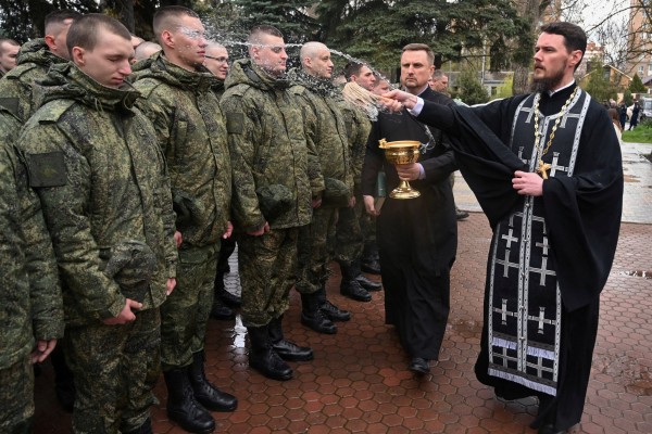 An Orthodox priest blesses Russian conscripts during a ceremony in Bataysk, in the Rostov region of Russia on Friday. Photo: Reuters