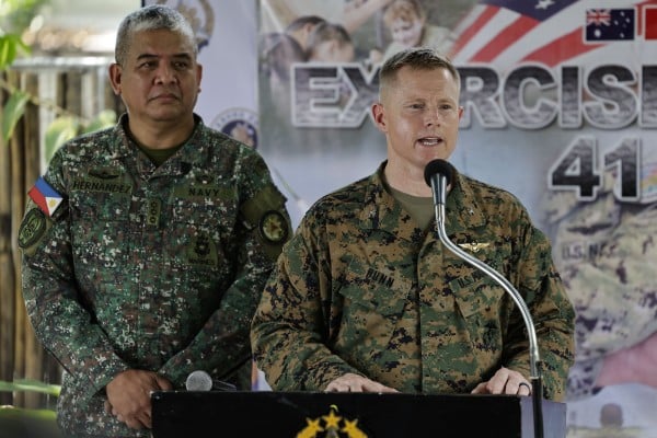 Philippine Navy Colonel Dennis Hernandez (left) looks on as United States Marines Colonel Robert Bunn speaks during a Balikatan briefing on Tuesday. Photo: EPA Philippine Navy Colonel Dennis Hernandez (left) looks on as United States Marines Colonel Robert Bunn speaks during a Balikatan briefing on Tuesday. Photo: EPA