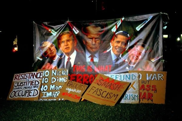 A banner at a protest in Singapore’s Hong Lim Park on Saturday shows past and present US presidents with horns on their heads. Photo: Instagram/sgacadboycott A banner at a protest in Singapore’s Hong Lim Park on Saturday shows past and present US presidents with horns on their heads. Photo: Instagram/sgacadboycott