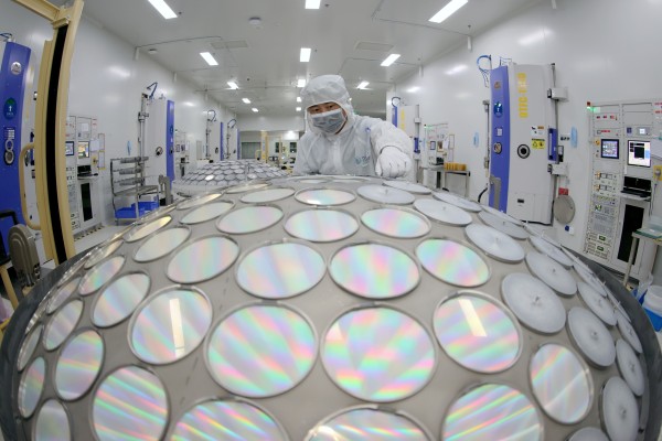A worker produces LED chips on a production line in China’s Jiangsu province. Photo: Getty Images