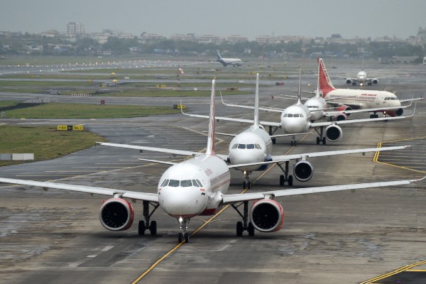 Aircraft queue up on the tarmac before taking off at Mumbai airport. Photo: AFP