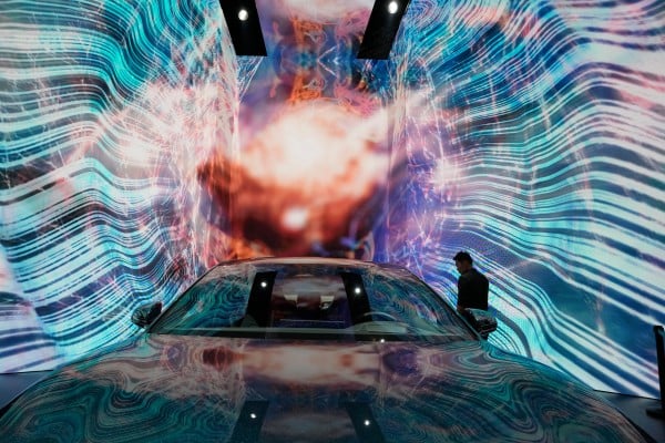 A man looks at an EV from a Chinese carmaker at an auto expo in Shanghai. Photo: AP A man looks at an EV from a Chinese carmaker at an auto expo in Shanghai. Photo: AP