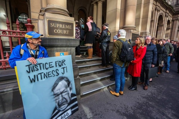 People queue to enter the Supreme Court of Victoria in Melbourne. Photo: AFP People queue to enter the Supreme Court of Victoria in Melbourne. Photo: AFP