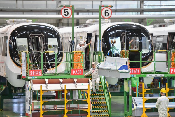 Workers operate on a production line at an assembly workshop of CRRC Zhuzhou Locomotive in China’s Hunan province. Photo: Xinhua