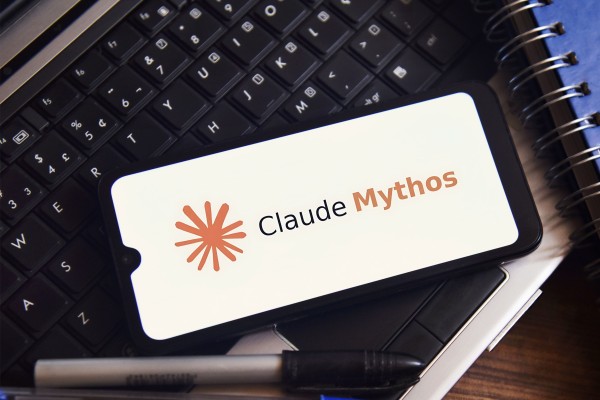 The Claude Mythos logo is displayed on a smartphone screen in this arranged photograph. Photo: Dreamstime/TNS