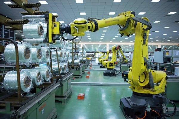 Robotic arms handle materials on a production line in China’s Zhejiang province. Beijing has plans to develop a service sector that shores up the world’s factory. Photo: Getty Images Robotic arms handle materials on a production line in China’s Zhejiang province. Beijing has plans to develop a service sector that shores up the world’s factory. Photo: Getty Images