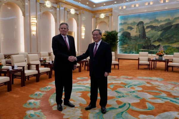 Chinese Premier Li Qiang greets US Senator Steve Daines ahead of their meeting at the Great Hall of the People in Beijing on March 23, 2025. Photo: Pool via Reuters Chinese Premier Li Qiang greets US Senator Steve Daines ahead of their meeting at the Great Hall of the People in Beijing on March 23, 2025. Photo: Pool via Reuters