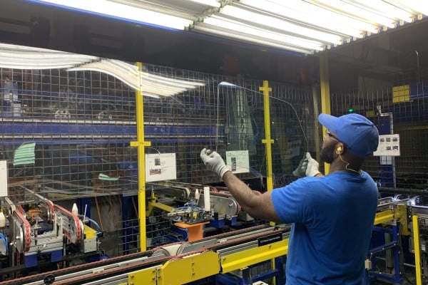 A worker checks the appearance of glass at a factory of glass manufacturer Fuyao in Dayton, Ohio. Photo: Xinhua A worker checks the appearance of glass at a factory of glass manufacturer Fuyao in Dayton, Ohio. Photo: Xinhua