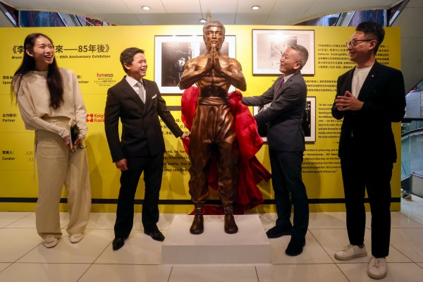 (From left) Lawmaker Vivian Kong Man-wai, Prudential Enterprise director Gabriel Li, lawmaker Perry Yiu and curator Heiman Ng at the unveiling of the Bruce Lee statue at the Prudential Centre on Nathan Road. Photo: Jonathan Wong