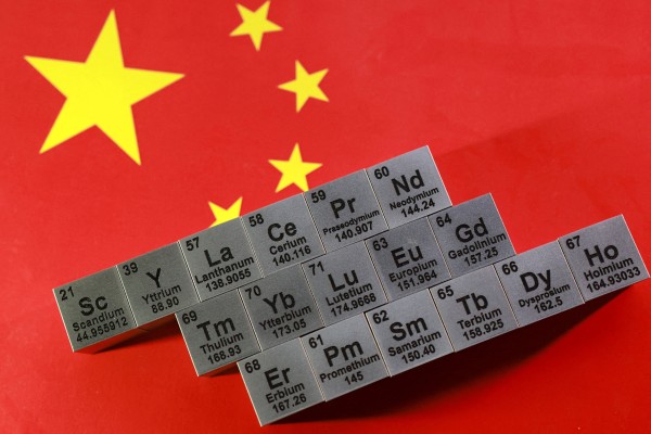 Blocks with symbols and atomic numbers of various rare earth elements are seen on a Chinese flag. Illustration: Reuters