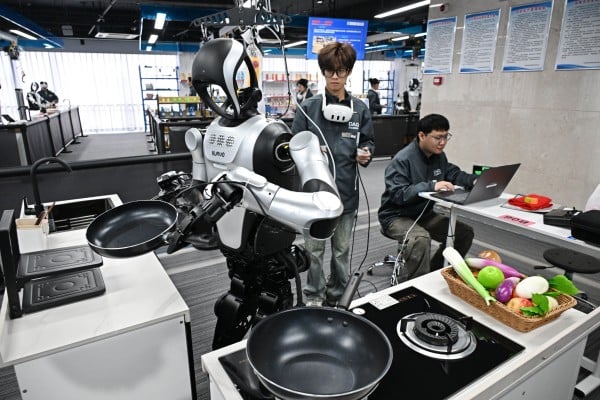 Employees put a robot through its paces at the Qingdao Humanoid Robot Data Training Centre in Qingdao, Shandong province, on March 23. Photo: Xinhua Employees put a robot through its paces at the Qingdao Humanoid Robot Data Training Centre in Qingdao, Shandong province, on March 23. Photo: Xinhua