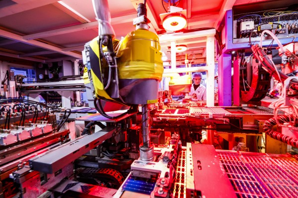 A worker produces photovoltaic modules for export at the workshop of a new-energy company in China’s Jiangsu province. Findings indicate a disproportionately high number of “zombie companies” in the nation’s renewables sector. Photo: Getty Images