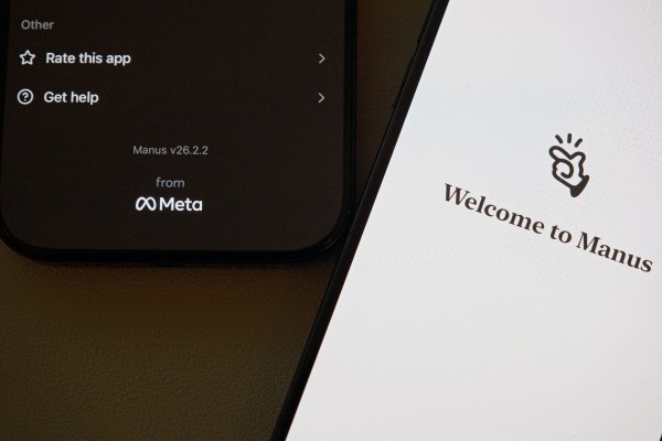The Manus AI agent app is displayed on mobile phones with the logo of US tech giant Meta in the app interface. Photo: Reuters