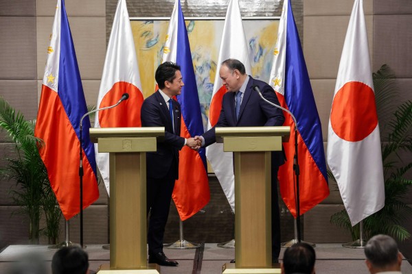 Japan’s Defence Minister Shinjiro Koizumi (left) and Philippines’ Defence Secretary Gilbert Teodoro Jnr shake hands after a bilateral meeting in Manila on Tuesday. Photo: AFP