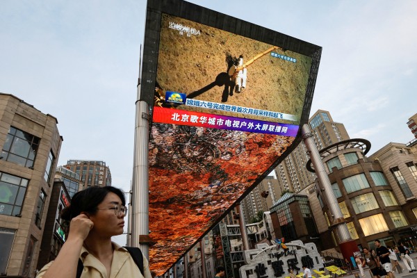 A large screen shows news footage of China’s Chang’e-6 lunar probe collecting a sample from the far side of the moon, in Beijing, China, on June 4, 2024. Photo: Reuters A large screen shows news footage of China’s Chang’e-6 lunar probe collecting a sample from the far side of the moon, in Beijing, China, on June 4, 2024. Photo: Reuters
