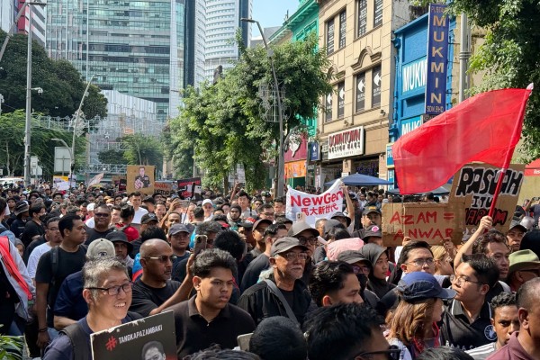 Around 200 protesters march through central Kuala Lumpur to rally against MACC chief  Azam Baki on April 25. Photo: Iman Muttaqin Yusof