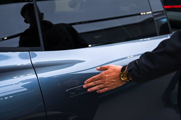 A Zeekr X7 electric vehicle with a flush door handle is on display at a showroom in Beijing. Photo: AFP A Zeekr X7 electric vehicle with a flush door handle is on display at a showroom in Beijing. Photo: AFP