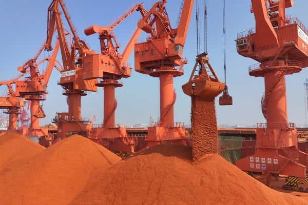 Cranes unload bauxite ore imported from Australia at a port in China’s eastern Shandong province. Photo: Reuters Cranes unload bauxite ore imported from Australia at a port in China’s eastern Shandong province. Photo: Reuters