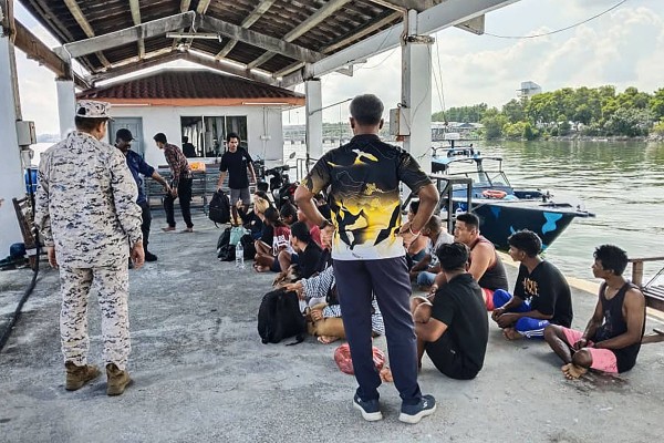 Indonesian survivors rescued during a search and rescue operation by Malaysian authorities off the coast of Pangkor Island in Perak, after a boat carrying migrants capsized on Monday. Photo: AFP/Malaysian Maritime Enforcement Agency 