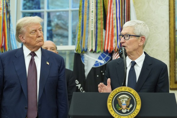 Apple CEO Tim Cook with US President Donald Trump during an event in the Oval Office of the White House on August 6, 2025. Photo: AP