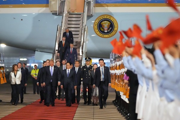US Defence Secretary Pete Hegseth (third from top) descends the steps of Air Force One as President Donald Trump walks with Chinese Vice-President Han Zheng during a welcome ceremony in Beijing on Wednesday. Photo: AP