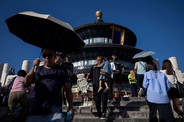 FILE PHOTO: Visitors walk down the stairs in front of the Hall of Prayer for Good Harvests at the Temple of Heaven, or Tiantan Park, in Beijing, China, September 14, 2025. REUTERS/Maxim Shemetov/File Photo
