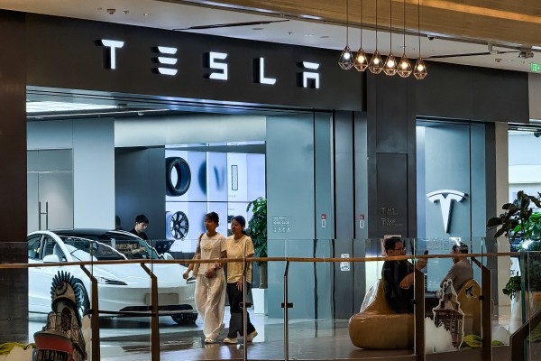People walk past a Tesla showroom inside a shopping mall in Chongqing, China, on June 23, 2025. Photo: Getty Images