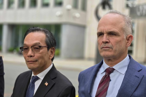 Lu Jianwang (left) and defence lawyer John Carman outside federal court in Brooklyn, New York, on Wednesday moments after the verdict was read. Photo: Mark Magnier