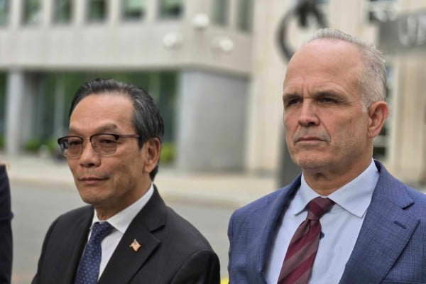Lu Jianwang (left) and defence lawyer John Carman outside federal court in Brooklyn, New York, on Wednesday moments after the verdict was read. Photo: Mark Magnier Lu Jianwang (left) and defence lawyer John Carman outside federal court in Brooklyn, New York, on Wednesday moments after the verdict was read. Photo: Mark Magnier