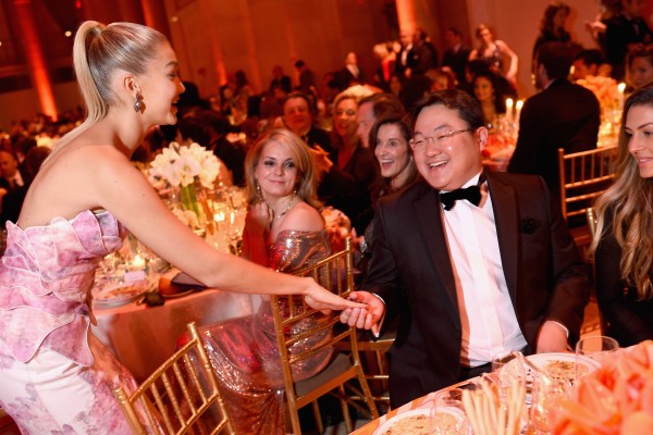 American fashion model Gigi Hadid and Jho Low (centre) attend an event in New York City in 2014. Photo: Getty Images for Gabrielle’s Angel Foundation/AFP