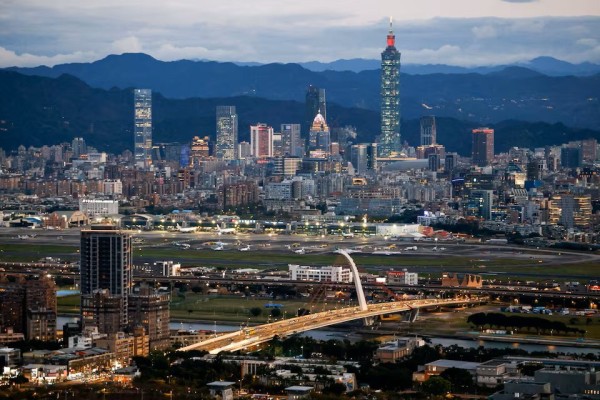 Taipei’s skyline, including the Taipei 101 skyscraper, rises beyond Songshan Airport. Photo: Reuters