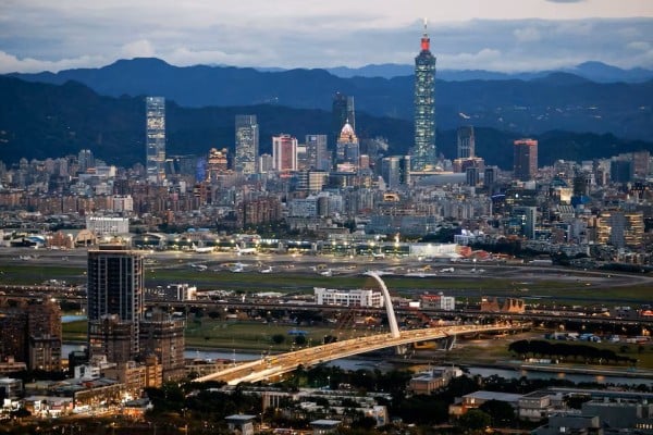 Taipei’s skyline, including the Taipei 101 skyscraper, rises beyond Songshan Airport. Photo: Reuters Taipei’s skyline, including the Taipei 101 skyscraper, rises beyond Songshan Airport. Photo: Reuters