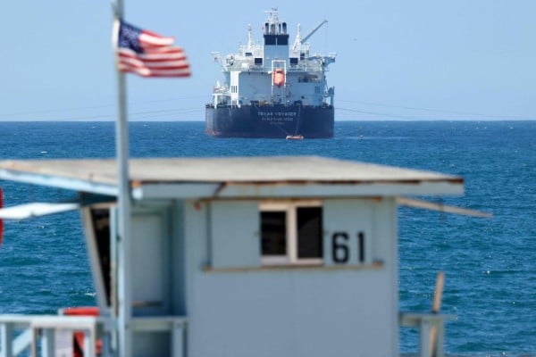 An American flag flies in front of the Texas Voyager oil and chemical tanker, anchored in the Pacific Ocean off the coast of the Chevron El Segundo refinery, on April 23. Photo: AFP An American flag flies in front of the Texas Voyager oil and chemical tanker, anchored in the Pacific Ocean off the coast of the Chevron El Segundo refinery, on April 23. Photo: AFP