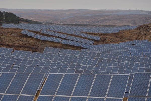 Rows of solar panels are seen at a photovoltaic farm in Datong, China. Photo: AP Rows of solar panels are seen at a photovoltaic farm in Datong, China. Photo: AP
