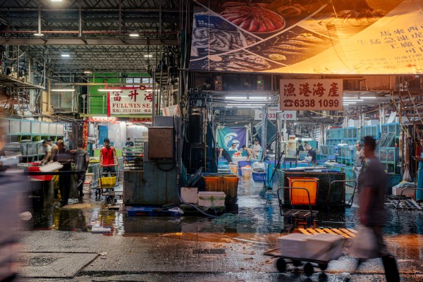 At 5am, it’s still dark at the Aberdeen Wholesale Fish Market, as fishermen and workers go about offloading the morning’s catch. Photo: Alexander Mak