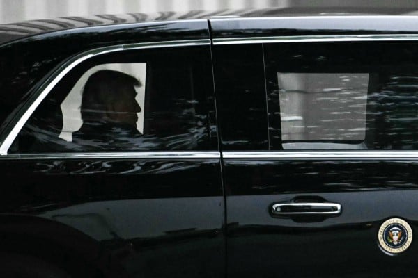 US President Donald Trump rides in his motorcade as he leaves Walter Reed National Military Medical Centre on Tuesday. Photo: AFP US President Donald Trump rides in his motorcade as he leaves Walter Reed National Military Medical Centre on Tuesday. Photo: AFP