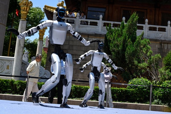 Humanoid robots manufactured by Unitree Robotics dance on the opening day of Asia’s first embodied intelligence experience store in Shanghai on Sunday. Photo: AFP