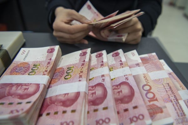 HAIAN, CHINA - MARCH 20, 2024 - A staff member counts Chinese yuan at a bank in Haian, East China’s Jiangsu province, March 20, 2024. (Photo credit should read CFOTO/Future Publishing via Getty Images) HAIAN, CHINA - MARCH 20, 2024 - A staff member counts Chinese yuan at a bank in Haian, East China’s Jiangsu province, March 20, 2024. (Photo credit should read CFOTO/Future Publishing via Getty Images)