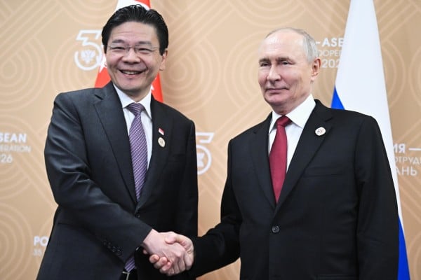 Singaporean Prime Minister Lawrence Wong (left) and Russian President Vladimir Putin shake hands during their meeting on the sidelines of the Russia-Asean Summit in Kazan on Thursday. Photo:
Sputnik/AP Singaporean Prime Minister Lawrence Wong (left) and Russian President Vladimir Putin shake hands during their meeting on the sidelines of the Russia-Asean Summit in Kazan on Thursday. Photo:
Sputnik/AP