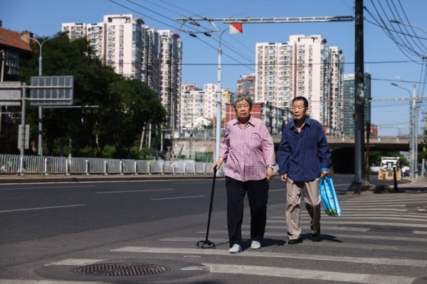 Two elderly people in Beijing on June 1. Photo: EPA Two elderly people in Beijing on June 1. Photo: EPA