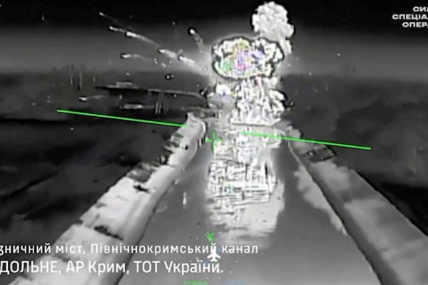 Drone footage shows fire and smoke rising from a bridge, which Ukraine's military says was destroyed by them, near Rozdolne, Crimea, in this screengrab from a handout video released on Tuesday. Photo: Reuters