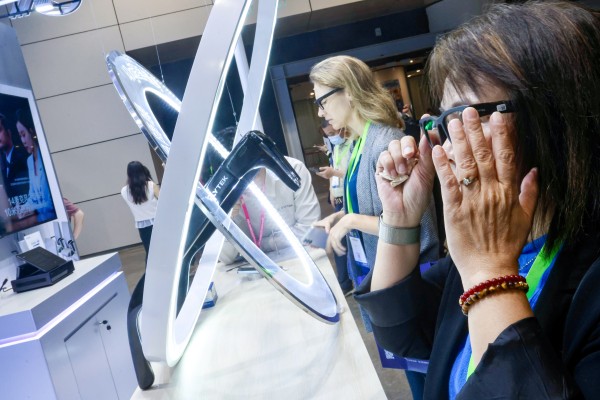 People try products at AI+ Power 2026, Hong Kong’s largest artificial intelligence expo and conference, at the Hong Kong Convention and Exhibition Centre in Wan Chai on June 4. Photo: Jonathan Wong