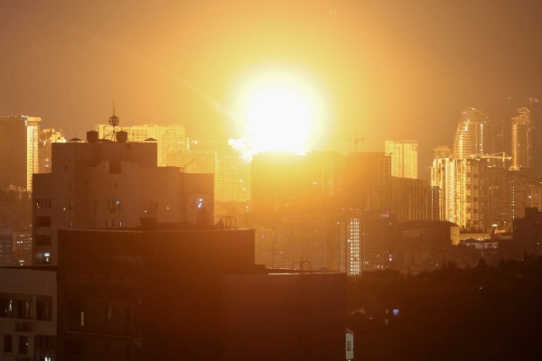 An explosion lights up the sky over Kyiv. Photo: Reuters