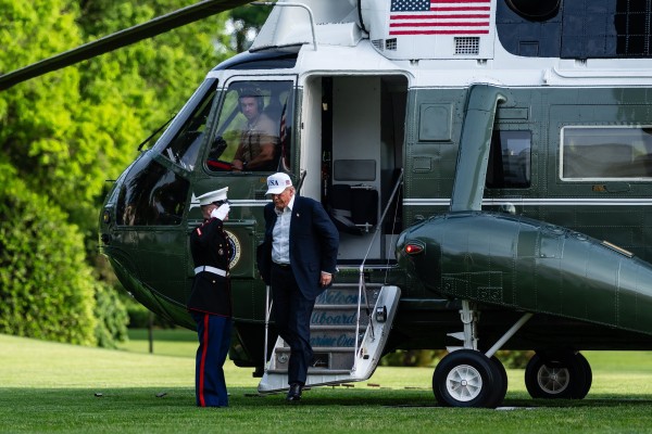 US President Donald Trump steps onto the South Lawn of the White House after arriving on Marine One in May. Photo: EPA