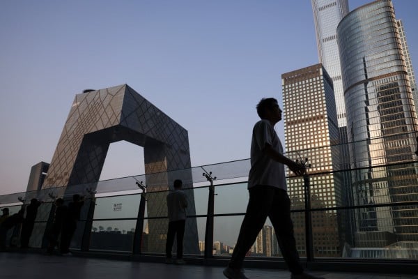 People are seen on the terrace of a shopping mall overlooking the central business district in Beijing. China was the world’s third-largest source of foreign direct investment in 2025. Photo: Reuters People are seen on the terrace of a shopping mall overlooking the central business district in Beijing. China was the world’s third-largest source of foreign direct investment in 2025. Photo: Reuters