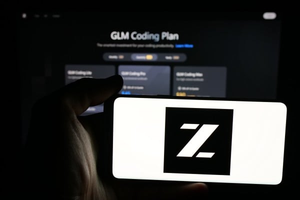 Person holding mobile phone with logo of Zhipu Huazhang Technology on screen in front of web page. The company recently marked a breakthrough with its GLM-5.2 model. Photo: Shutterstock Images Person holding mobile phone with logo of Zhipu Huazhang Technology on screen in front of web page. The company recently marked a breakthrough with its GLM-5.2 model. Photo: Shutterstock Images