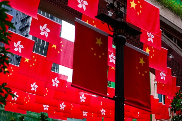 Local and national flags. The defendant claimed that only Taipei had lawful sovereignty over Hong Kong. Photo: Karma Lo
